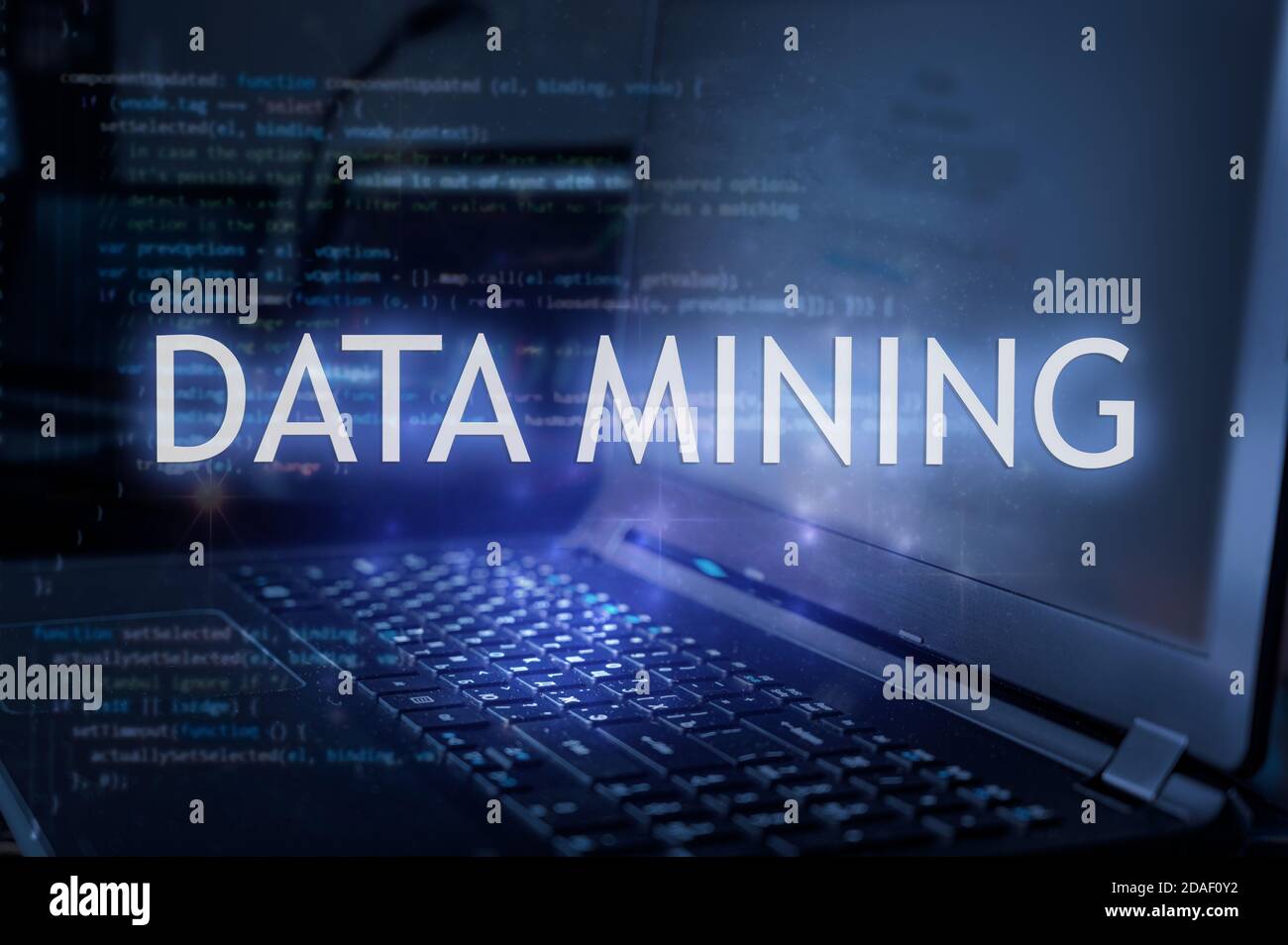Data mining inscription against laptop and code background. Stock Photo