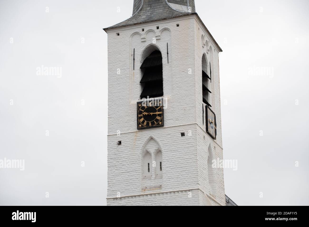 White church in Noordwijkerhout in the Netherlands with cloudy sky Stock Photo