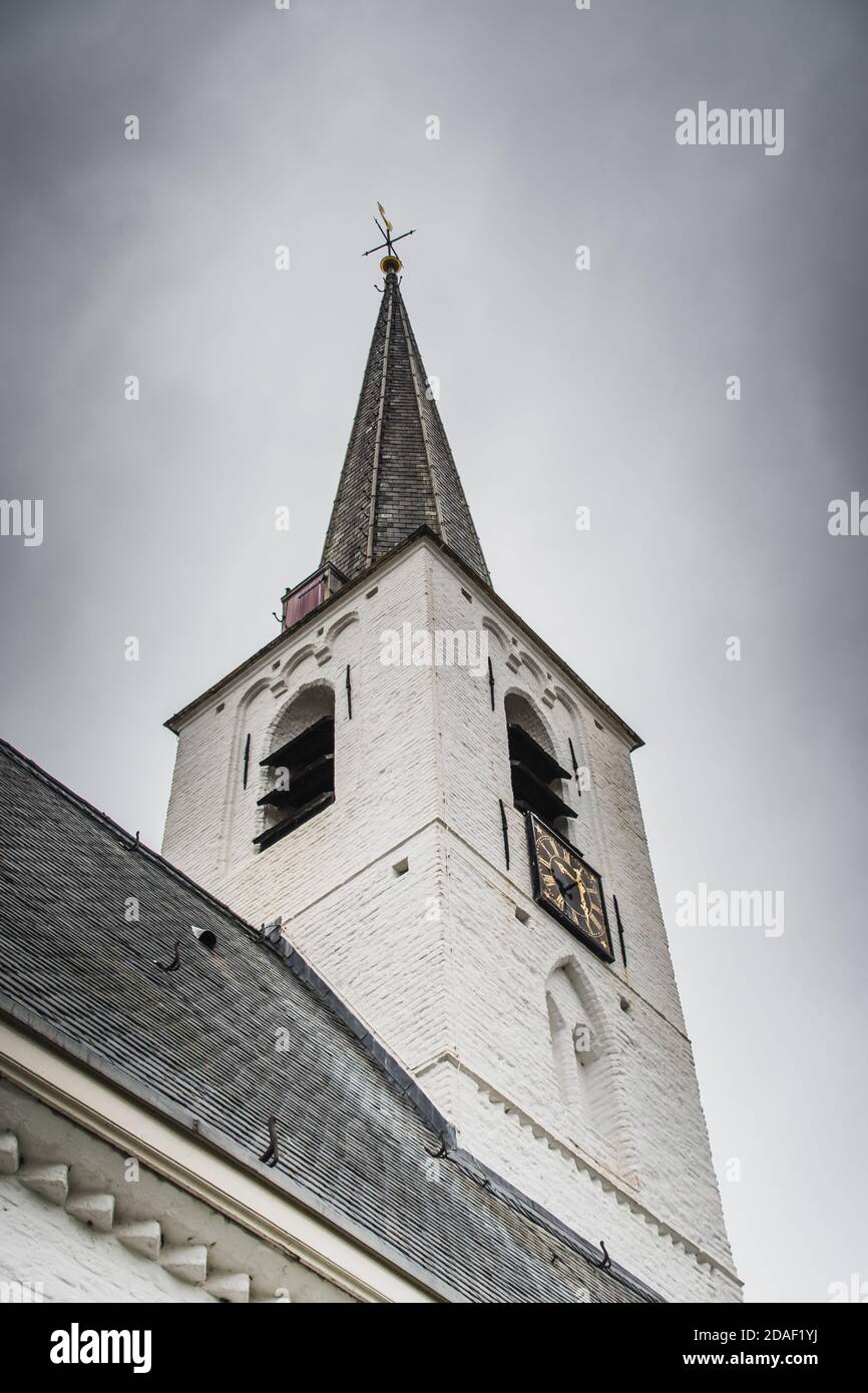 White church in Noordwijkerhout in the Netherlands with cloudy sky Stock Photo