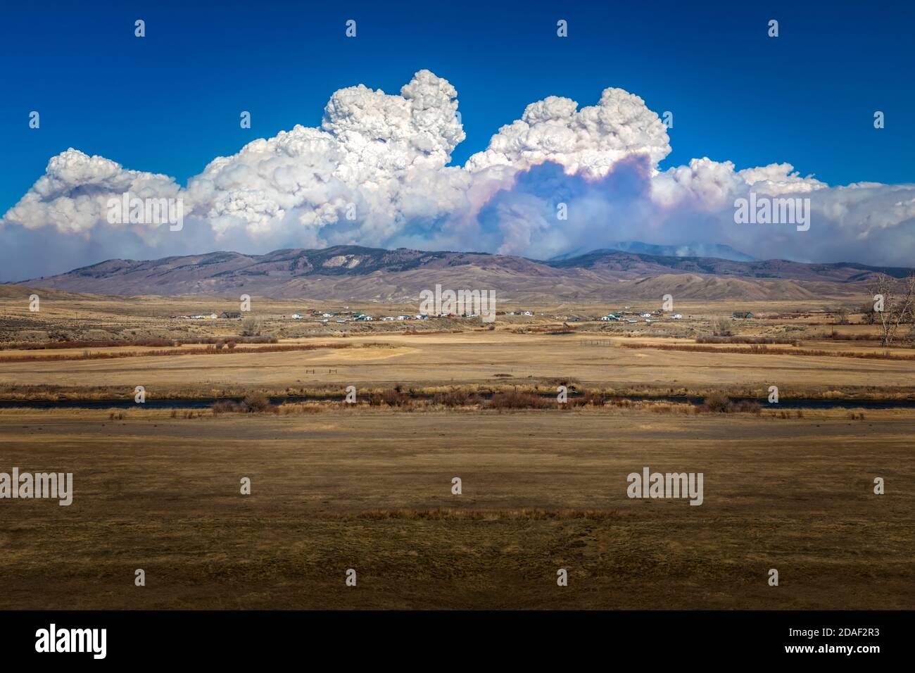 Thick smoke clouds over the Rocky Mountains in Colorado from the Cameron wildfires Stock Photo