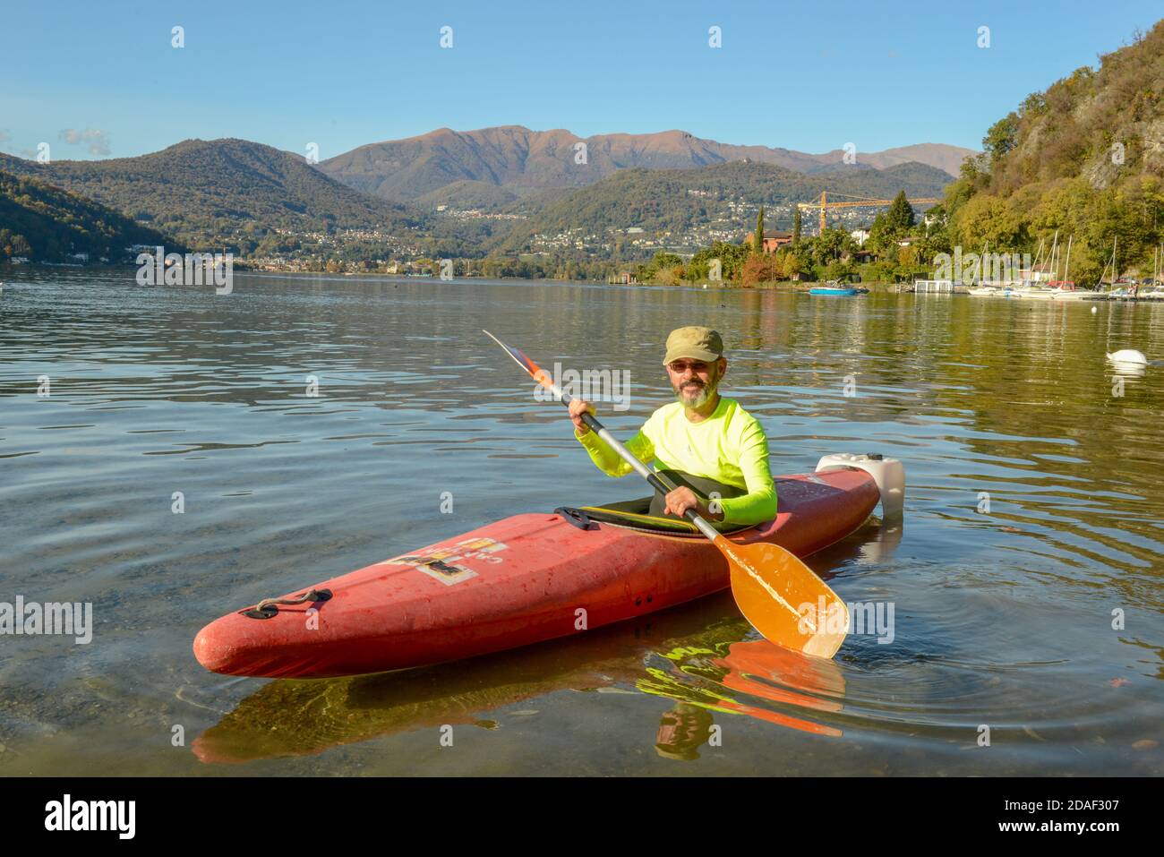 Lugano, Switzerland - 25 Oktober 2020: man who is rowing in his canoe on  lake of Lugano in Switzerland Stock Photo - Alamy