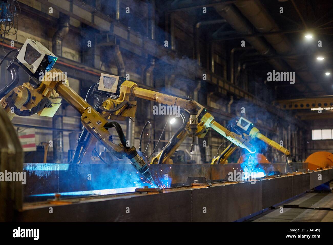 Robot welding is welding assembly automotive part in factory Stock Photo