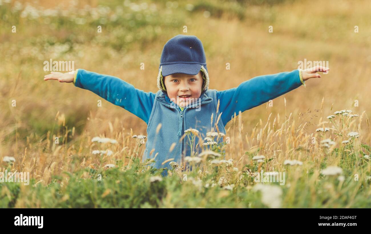 Little boys playing and having fun outside In Crop Field Stock Photo