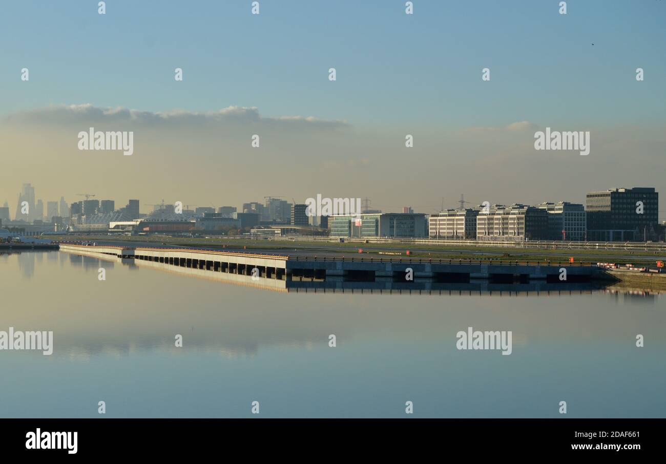A Westerly view down the King George V Dock in London of the new parallel taxiway as London City Airport Stock Photo