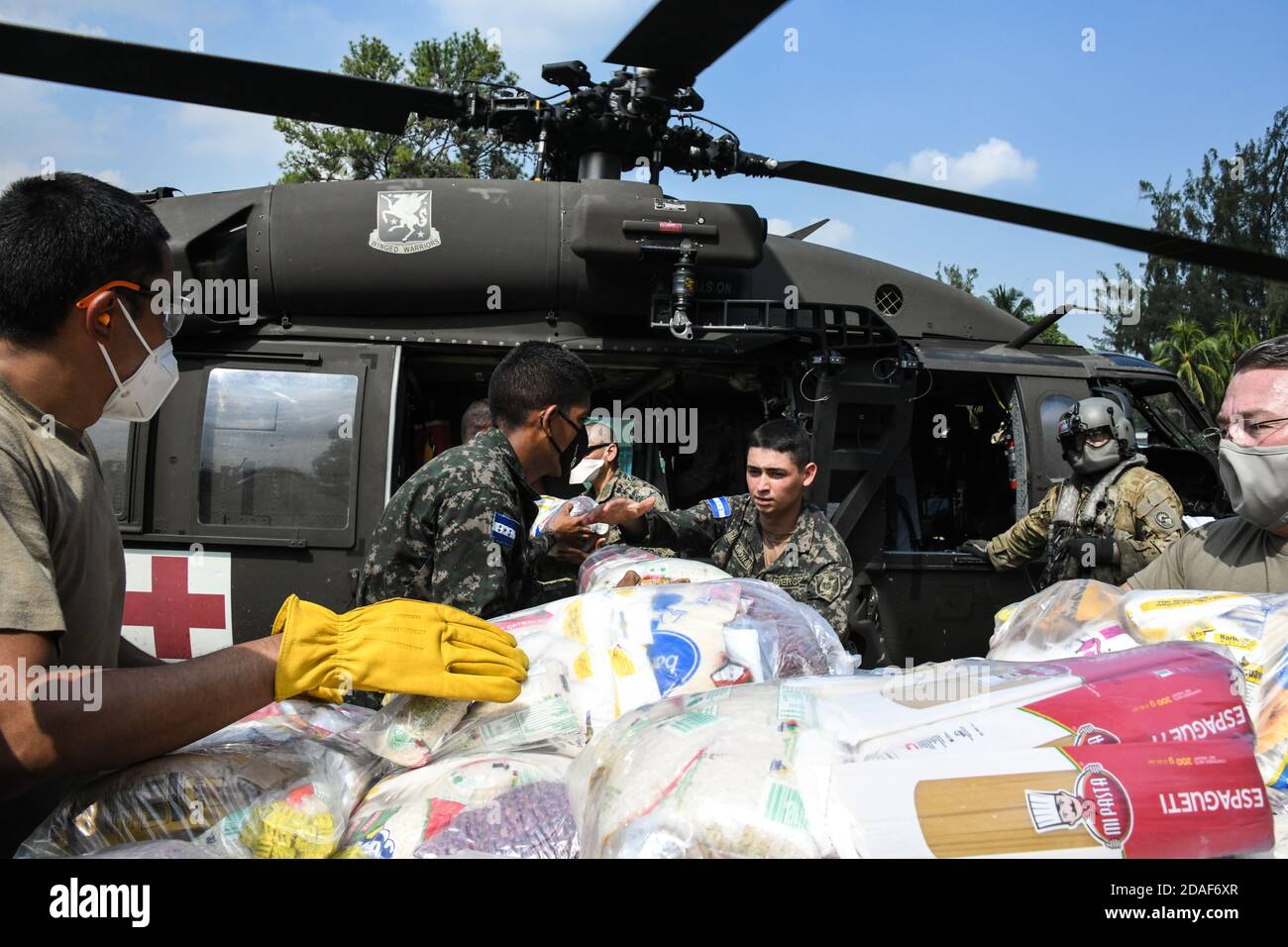 San Pedro Sula, Honduras. 27th Feb, 2020. U.S. Army Joint Task Force-Bravo soldiers and Honduran army load emergency supplies on to a U.S. Army HH-60 Black Hawk helicopter for delivery to regions affected by Hurricane Eta November 11, 2020 in San Pedro Sula, Honduras. The powerful cyclone killed at least 50 people and devastated parts of Nicaragua and Honduras. Credit: Planetpix/Alamy Live News Stock Photo