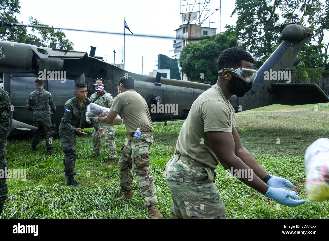 San Pedro Sula, Honduras. 11th Nov, 2020. U.S. Army Joint Task Force-Bravo soldiers and Honduran army load emergency supplies on to a U.S. Army HH-60 Black Hawk helicopter for delivery to regions affected by Hurricane Eta November 11, 2020 in San Pedro Sula, Honduras. The powerful cyclone killed at least 50 people and devastated parts of Nicaragua and Honduras. Credit: Planetpix/Alamy Live News Stock Photo
