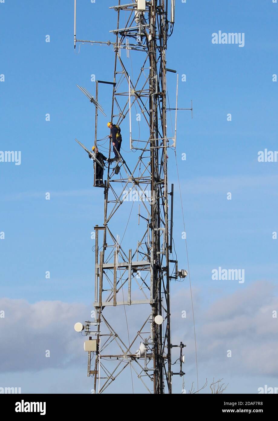Engineers carrying maintenance work on transmitter at the Trundle, near Chichester, West Sussex Stock Photo