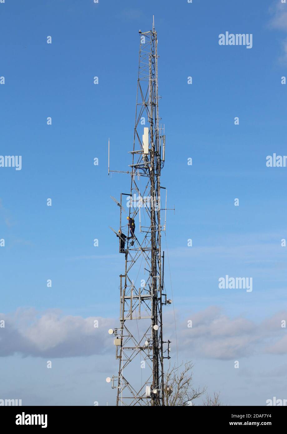Engineers carrying maintenance work on transmitter at the Trundle, near Chichester, West Sussex Stock Photo