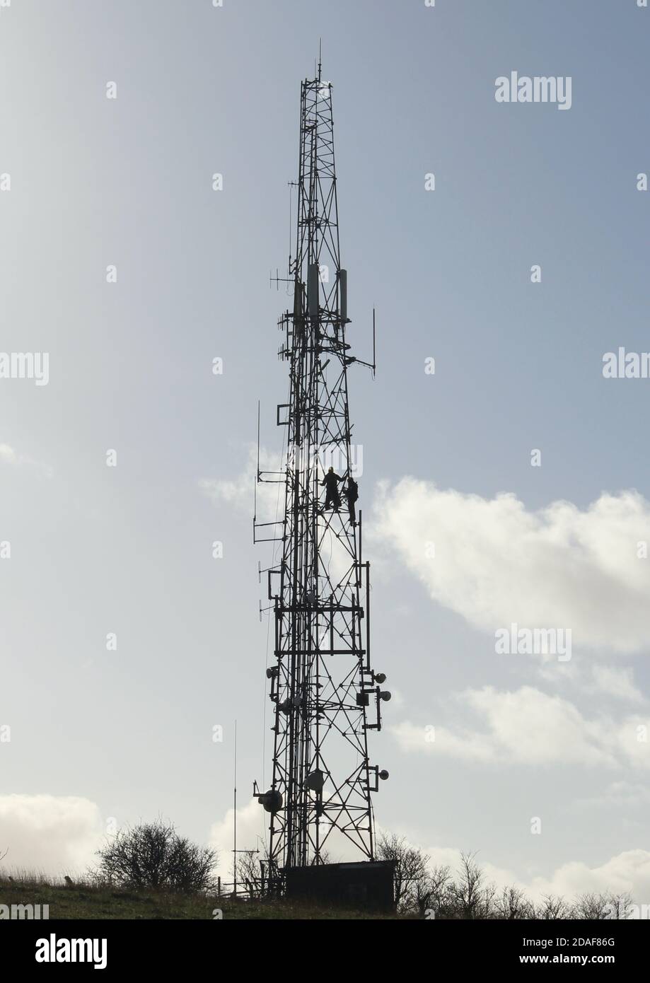 Engineers carrying maintenance work on transmitter at the Trundle, near Chichester, West Sussex Stock Photo