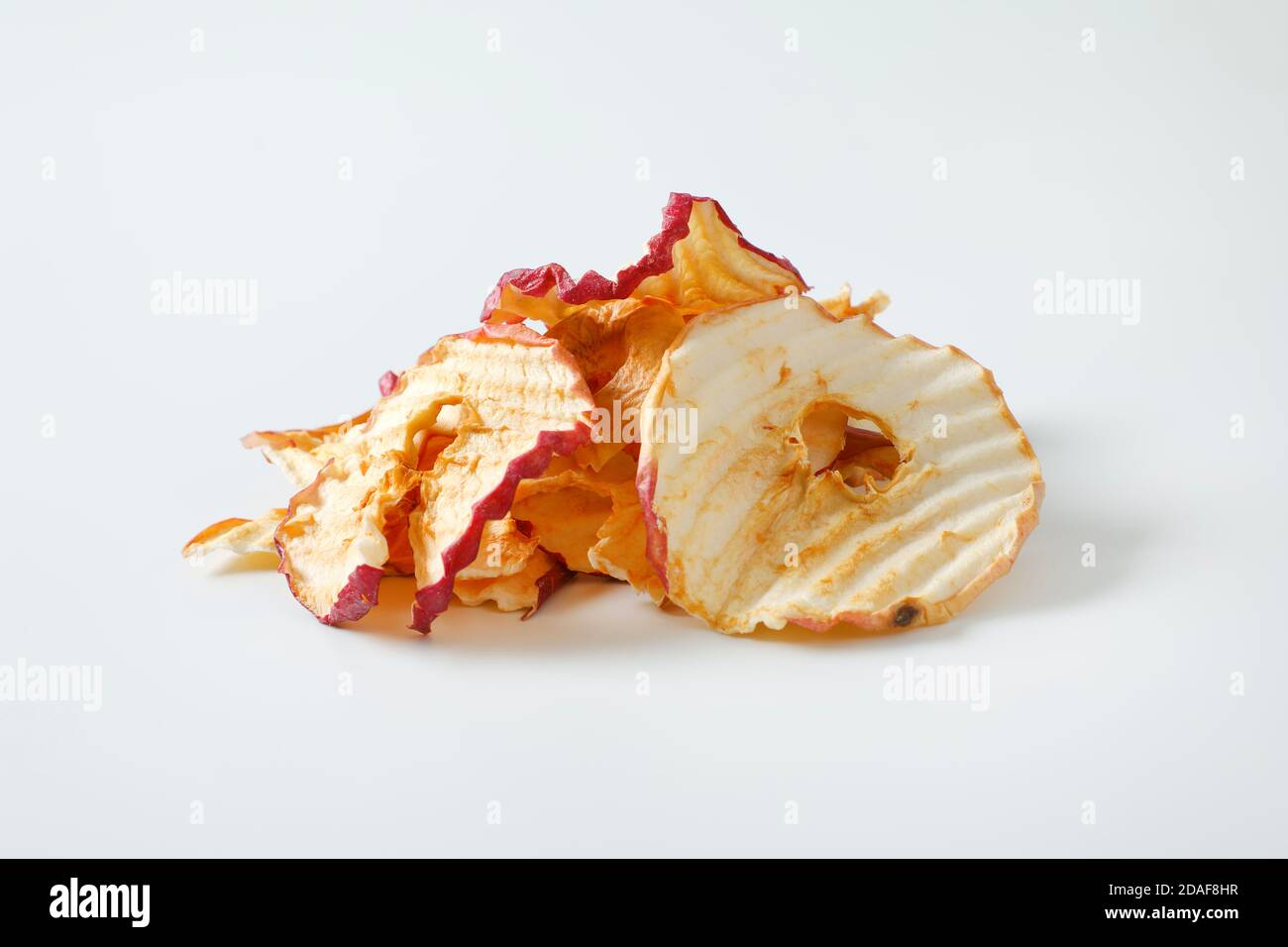 Heap of dried apple slices - apple chips or rings Stock Photo