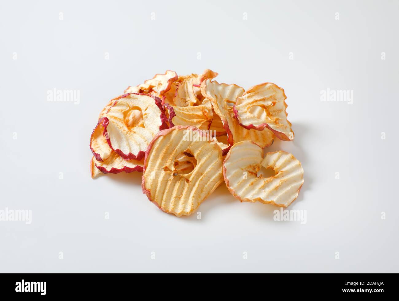 Heap of dried apple slices - apple chips or rings Stock Photo