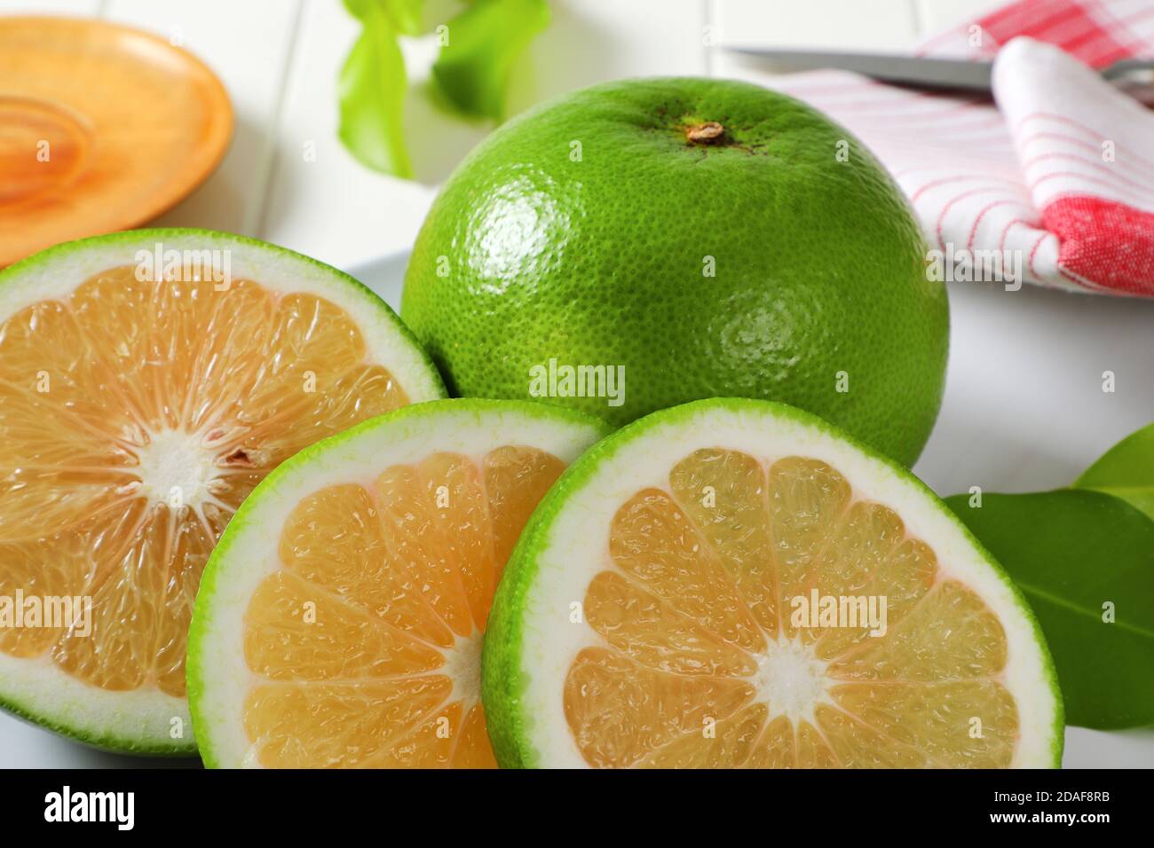 Sweetie fruit (green grapefruit, pomelit) - whole fruit and slices Stock Photo