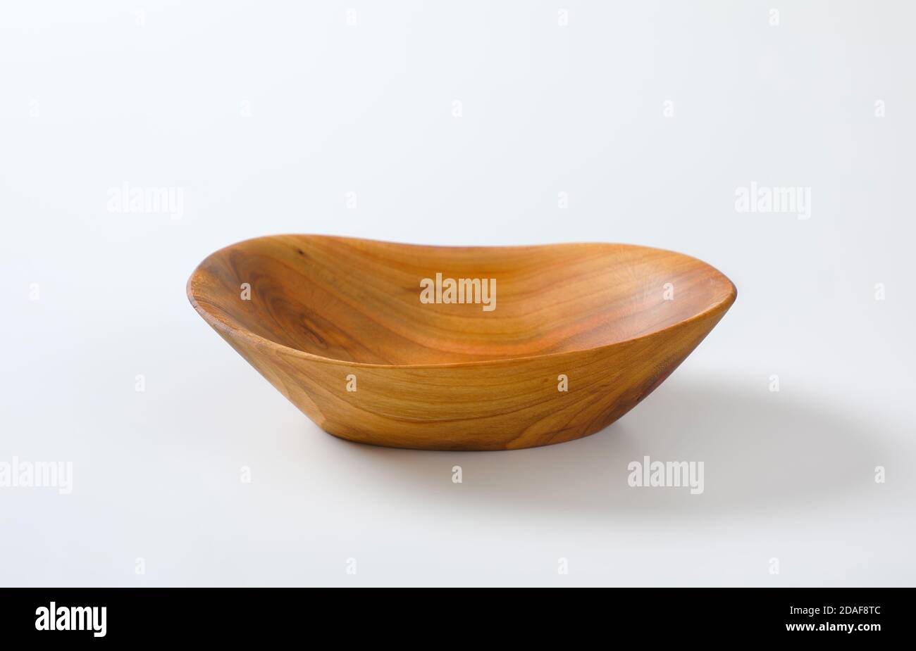 Boat shaped natural wood bowl Stock Photo