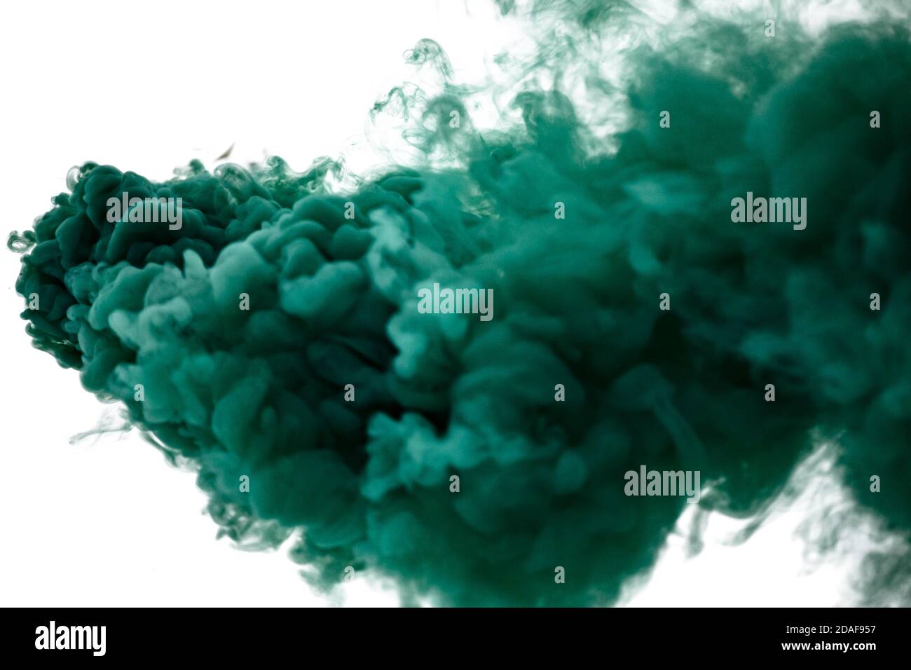 Burning fuse. Dynamite firecracker green fuse burn with sparkles and smoke  on black background. Stock Photo
