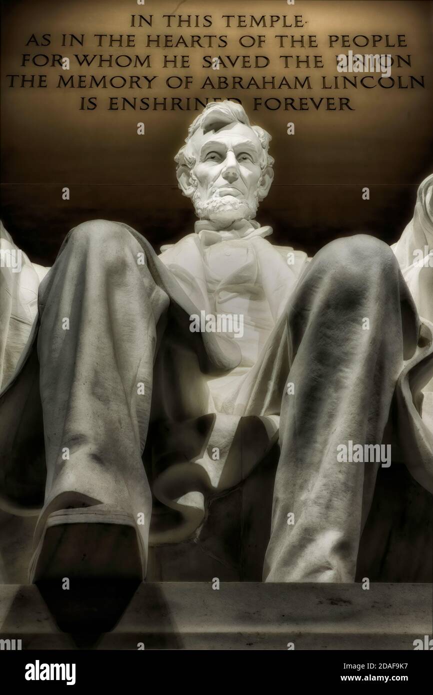 This statue of Abraham Lincoln is located inside the Lincoln Memorial. Daniel Chester Finch sculpted the statue. The statue was carved out of Georgia Stock Photo