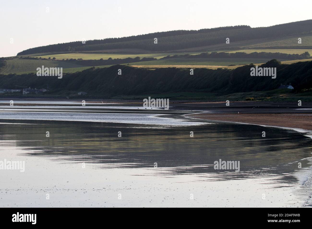 Croy Shore, Ayrshire, Scotland, Early morning light illuminates the beach at Croy as seen from Culzean Castle Stock Photo