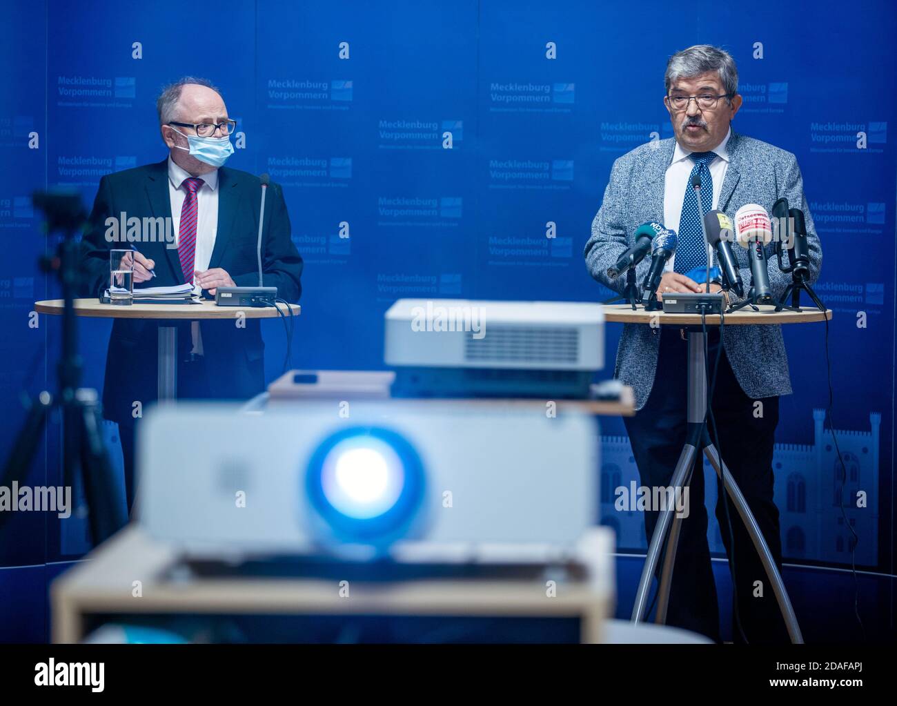 Schwerin, Germany. 12th Nov, 2020. Lorenz Caffier (CDU, r), the Minister of the Interior of Mecklenburg-Western Pomerania, and Reinhard Müller, Head of the Department for the Protection of the Constitution, present the 2019 Report on the Protection of the Constitution at a press conference. The number of left and right-wing extremist crimes in Mecklenburg-Western Pomerania has increased in the past year. Credit: Jens Büttner/dpa-Zentralbild/dpa/Alamy Live News Stock Photo