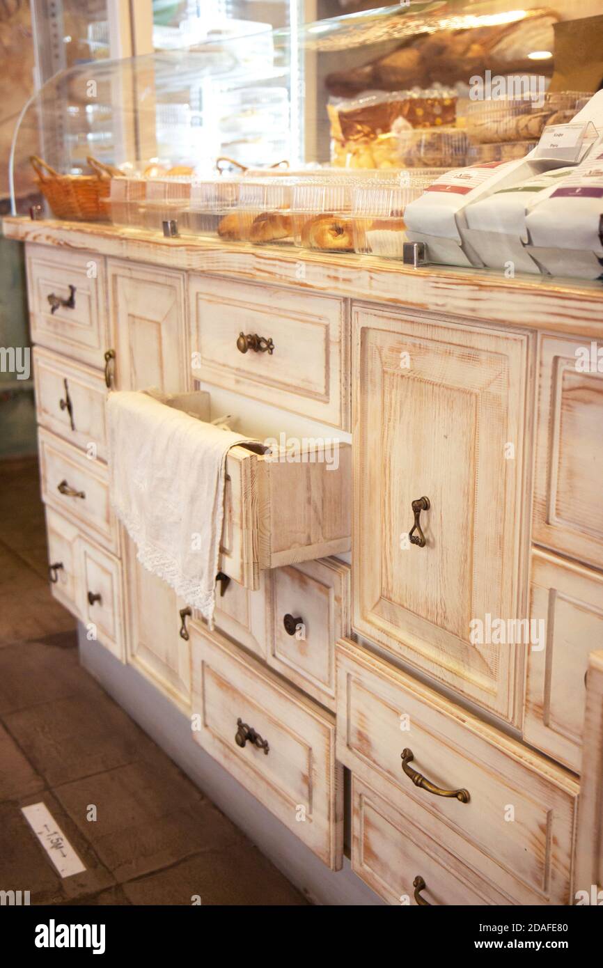 Antique, wooden chest of drawers in a restaurant. Many drawers with iron handles Stock Photo Alamy