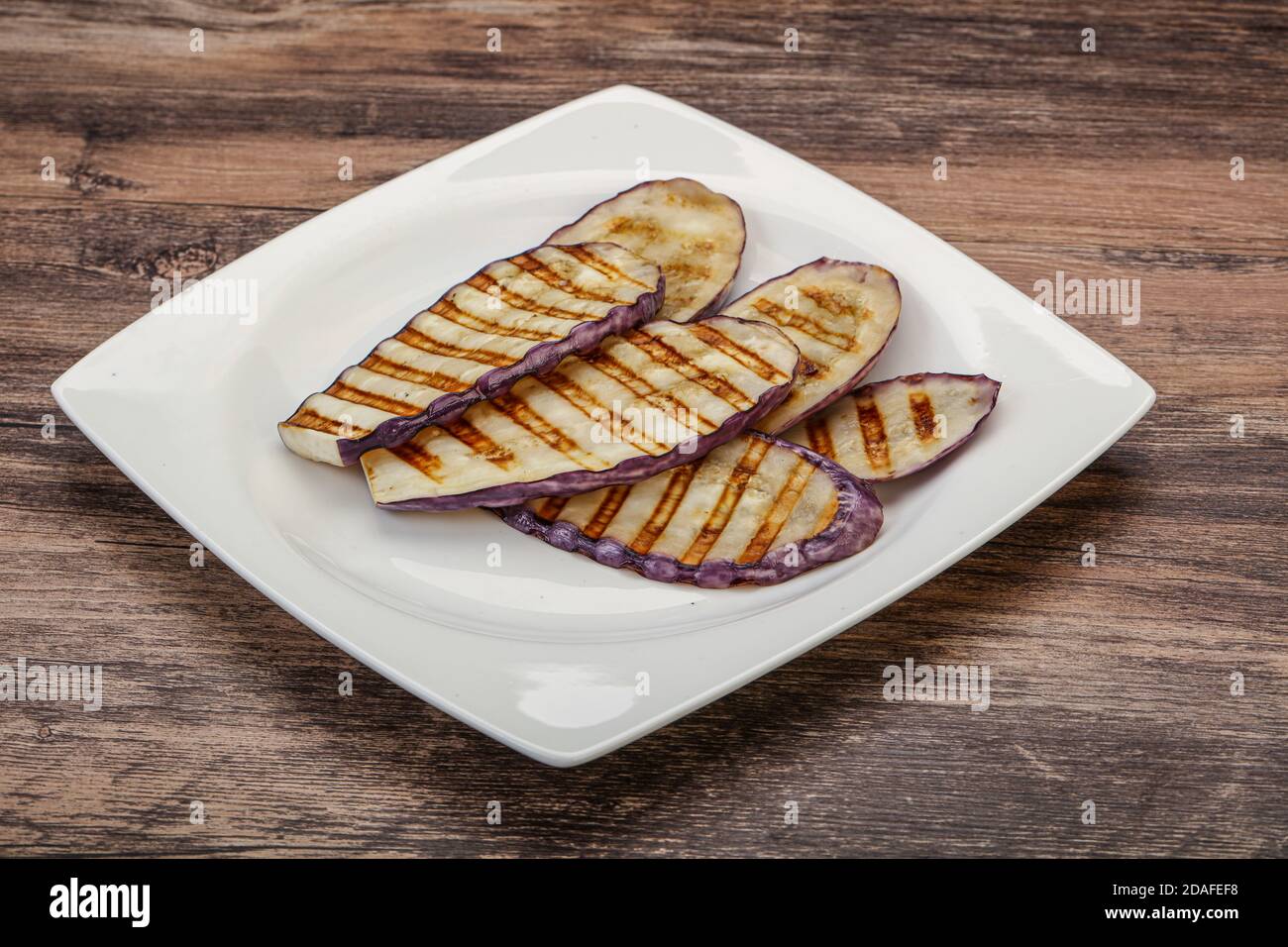 Grilled graffiti eggpant slices with olive oil Stock Photo Alamy