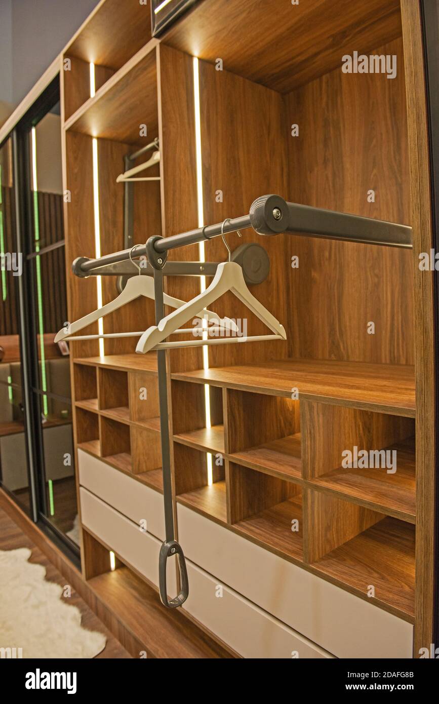 Interior design decor furnishing of luxury show home bedroom showing wooden wardrobe closet furniture Stock Photo