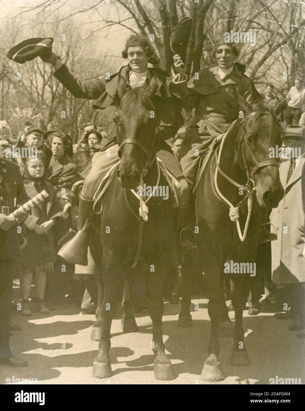 Antique c1935 photograph, actors portraying Paul Revere and William Dawes on horseback. Exact location unknown, possibly Lexington or Concord, Massachusetts on Patriots Day (April 19). SOURCE: ORIGINAL PHOTOGRAPH Stock Photo
