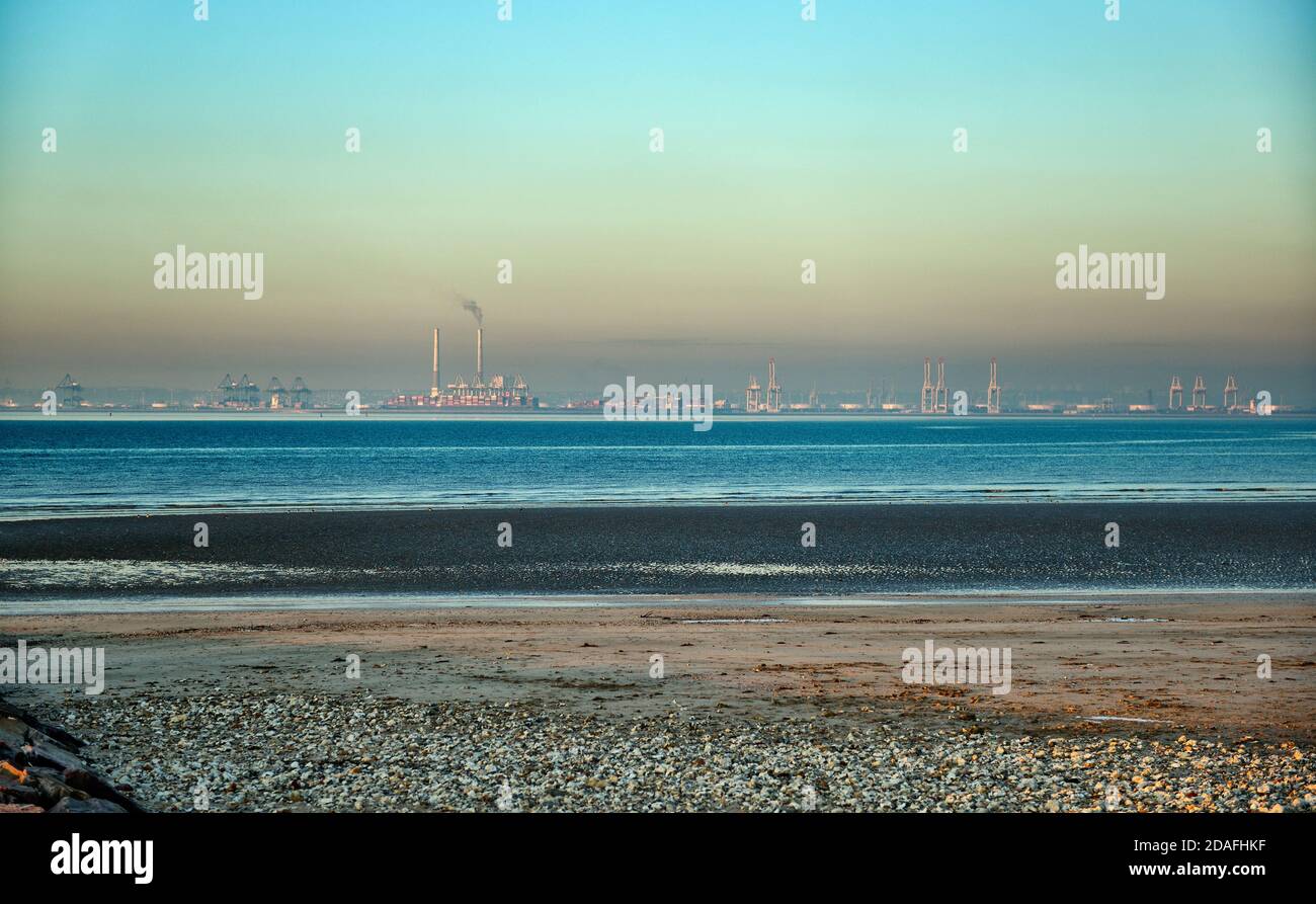 Le Havre, deep-water port, Beach in front, containers and cranes in background, Stock Photo