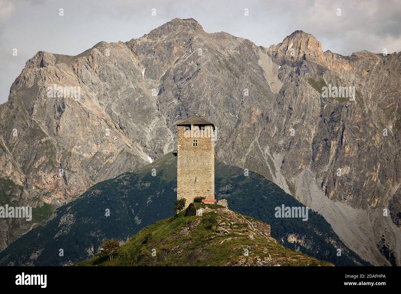 Ancient Medieval Castle Steinsberg in the small village of Ardez with the Swiss Alps. Engadin valley, Graubunden canton, Switzerland, Europe Stock Photo