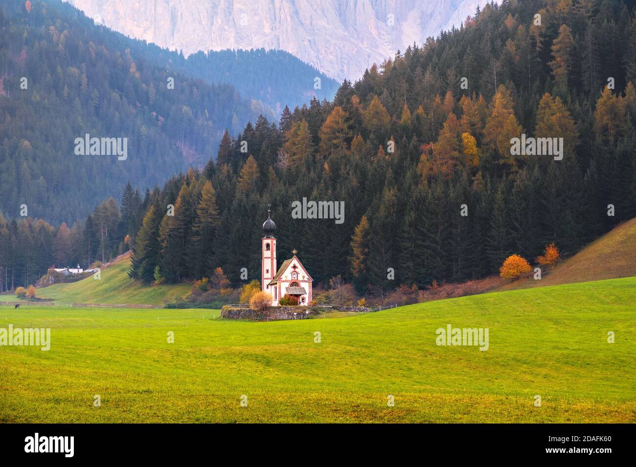 Famous and charming village of Santa Maddalena in the background of the Odle mountain range, Funes valley Trentino Alto Adige region in Italy Stock Photo