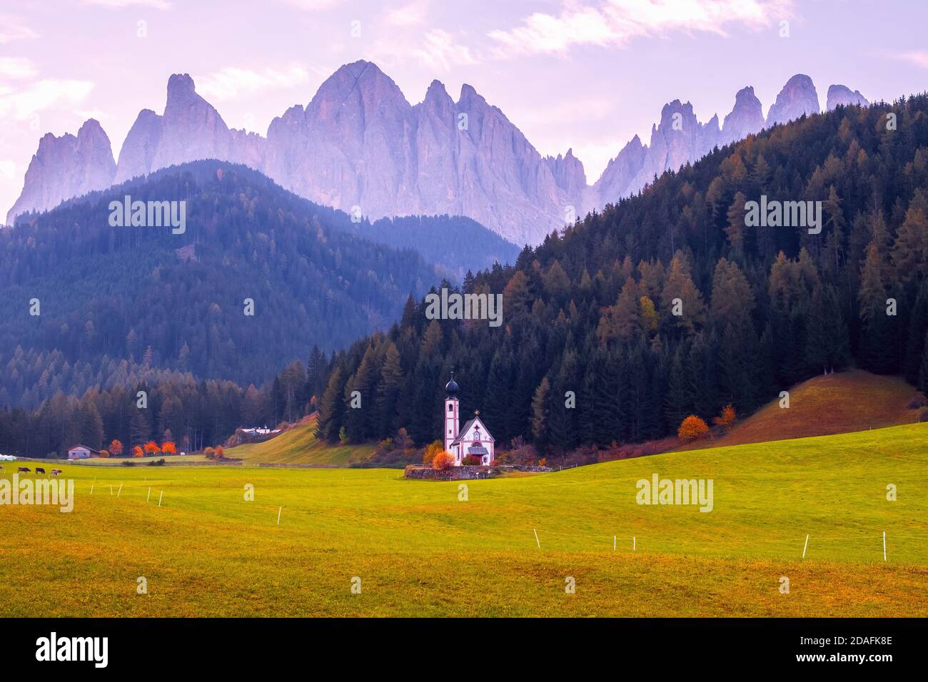 Famous and charming village of Santa Maddalena in the background of the Odle mountain range, Funes valley Trentino Alto Adige region in Italy Stock Photo