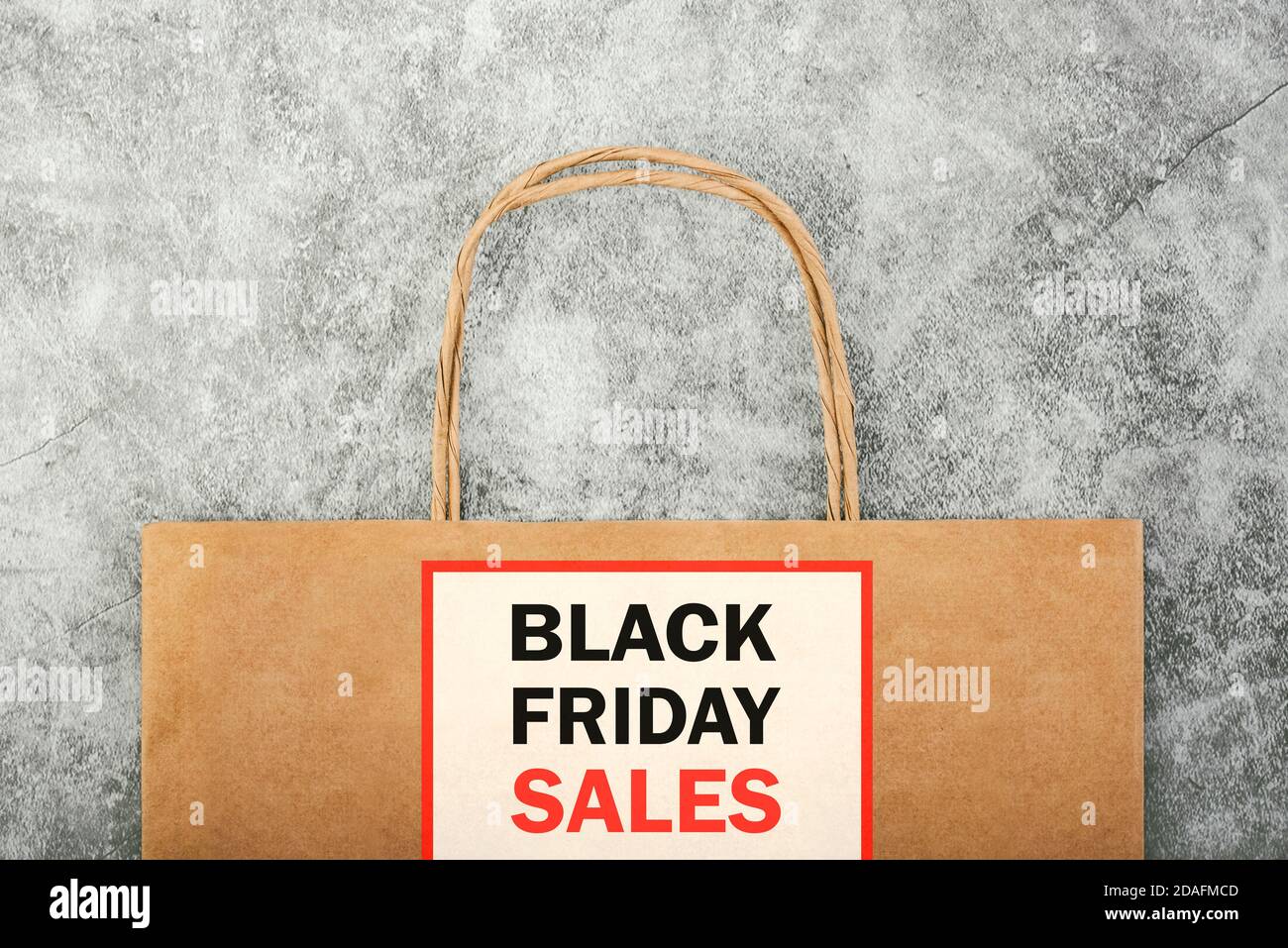 Black friday.Brown shopping bag with text on gray background.Shopping concept Stock Photo