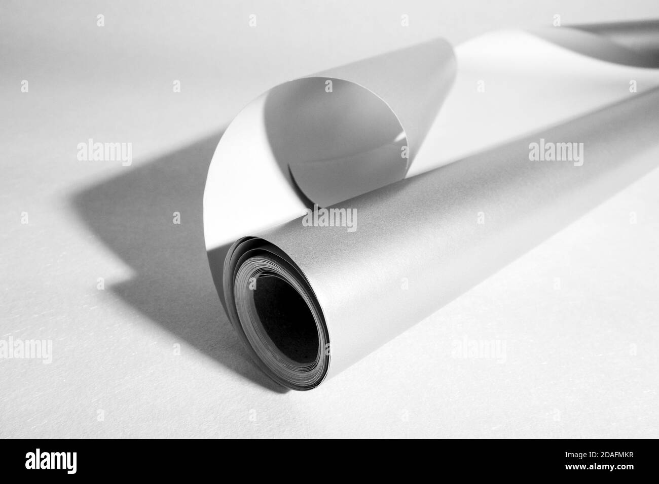 Side view of gray roll paper, black and white photo, selective focus Stock Photo