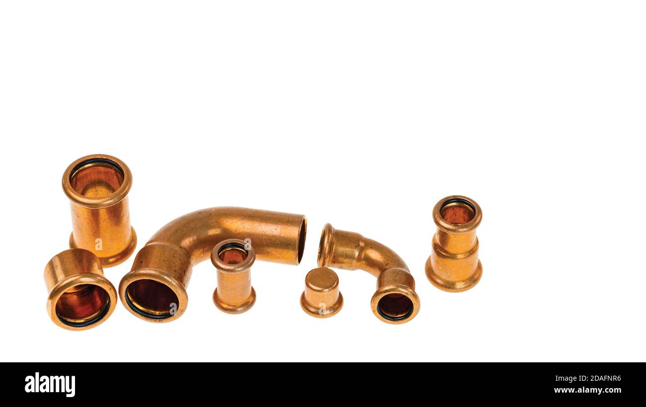 Close up view of different copper plumbing pipes isolated on white