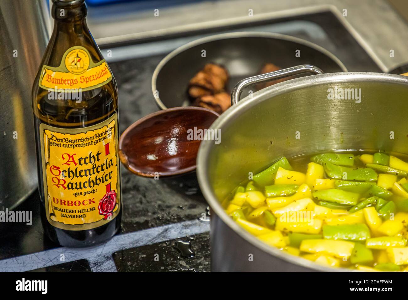 Melange of good ingredients: Savory and saffron as well as a good sip of Schlenkerla Rauchbier go into the soup pot in Bamberg, Germany Stock Photo