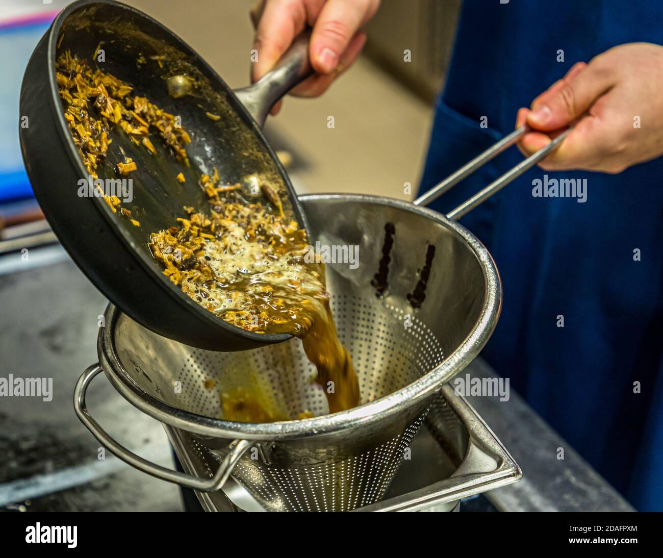 This is how you coax the sweetness out of the licorice. Grated and boiled in water. Bamberg, Germany Stock Photo