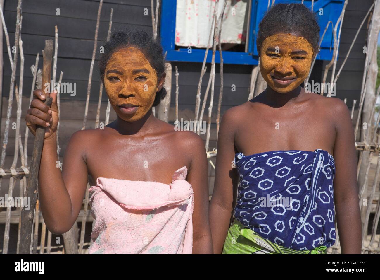Local girl, face applied with clay as sunblock, Morondava, Madagascar Stock Photo