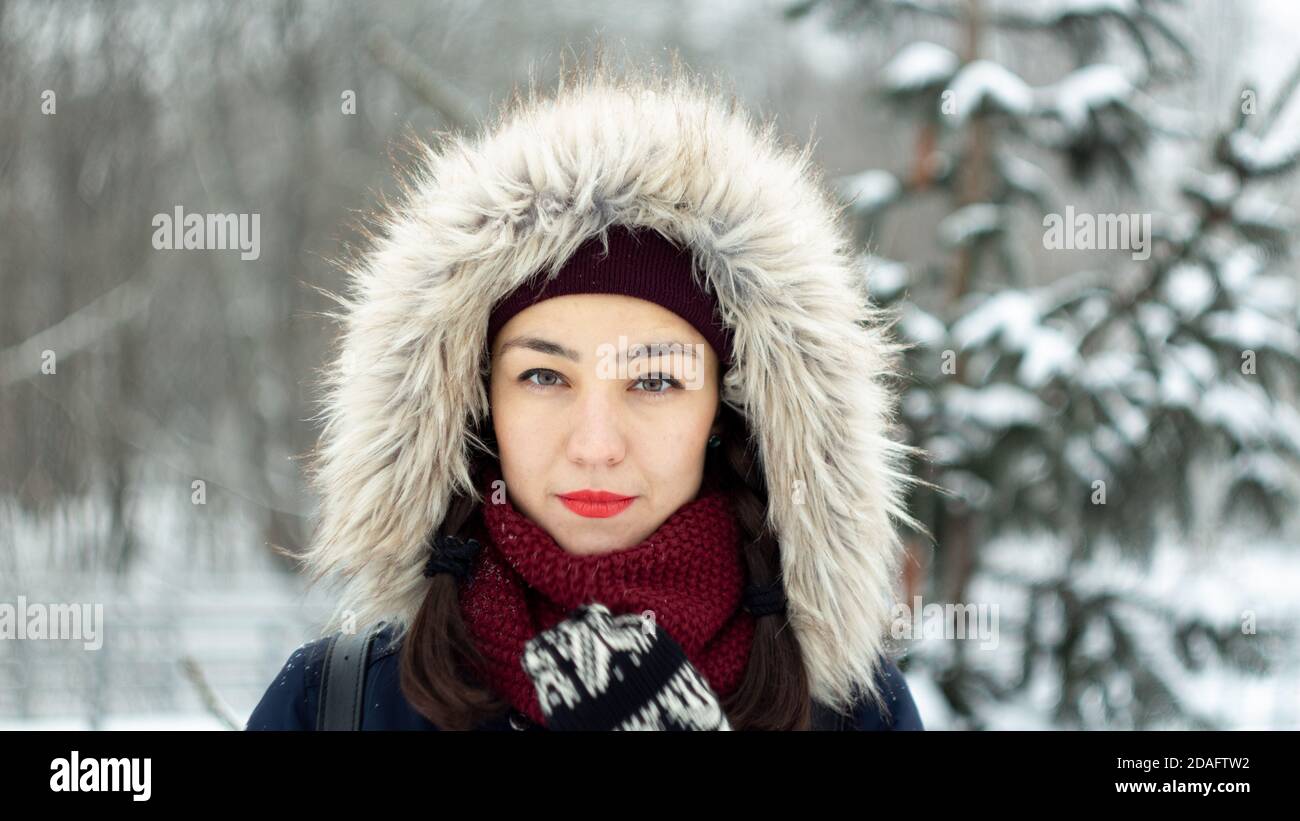 Portrait of a beautiful young girl in the winter forest Stock Photo - Alamy