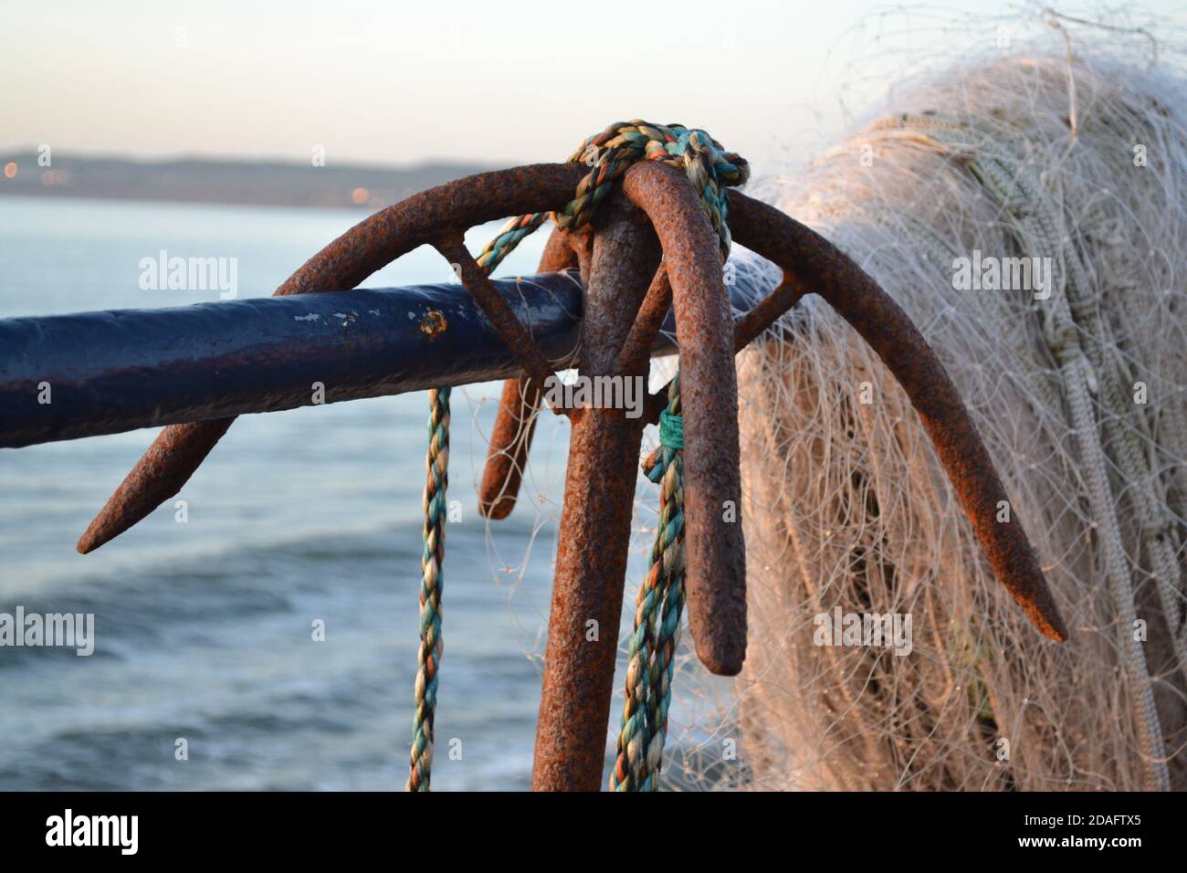 Rusty Anchor Crown - Fishing Net - North Sea - Filey - Yorkshire - UK Stock Photo