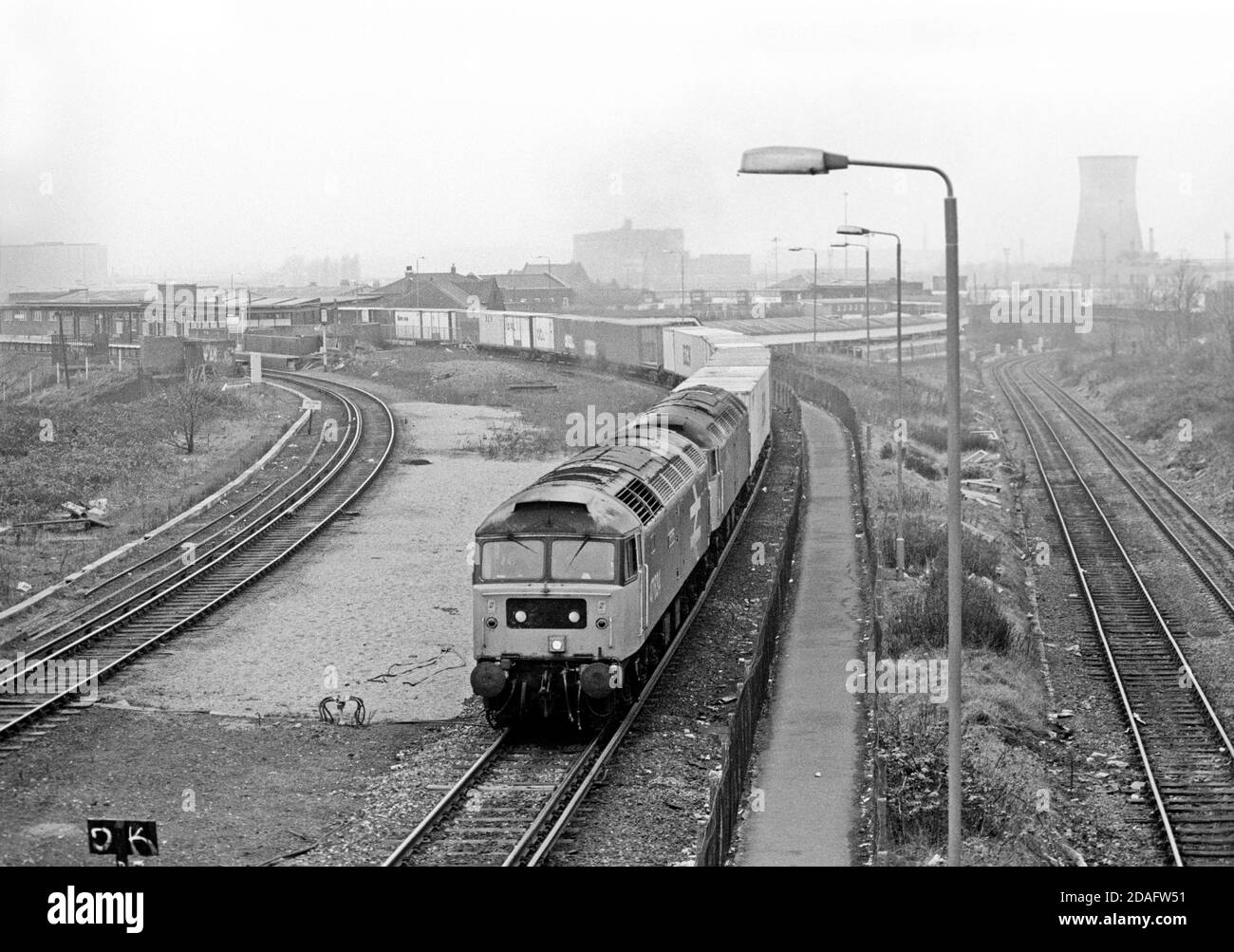A pair of Class 47 diesel locomotives numbers 47634 and 47536 power away from Willesden High Level towards the North London Line with a well loaded Freightliner on the 2nd February 1991. Stock Photo