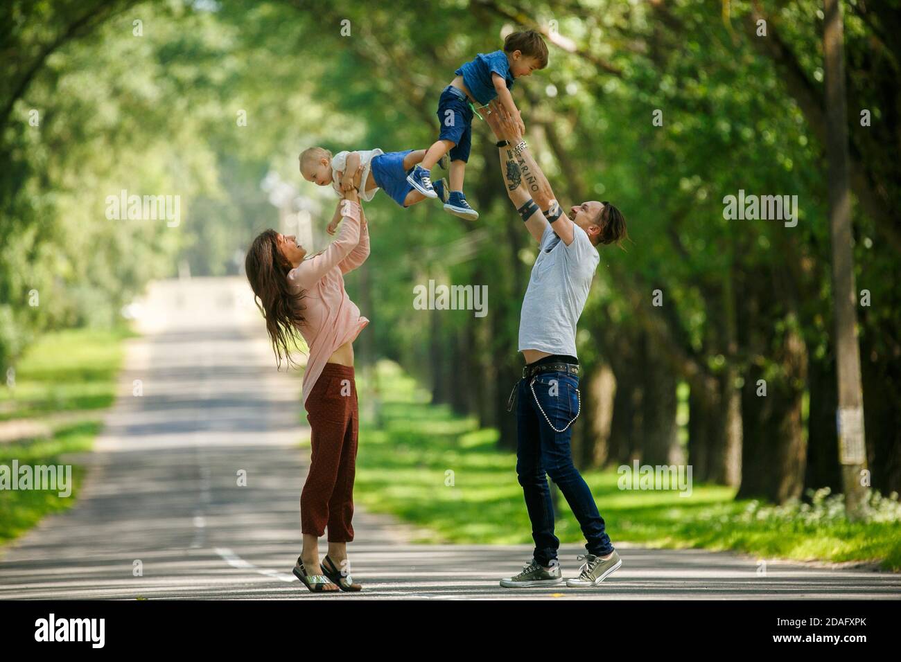 Four children playing in a playground - Stock Image - F033/7416 - Science  Photo Library