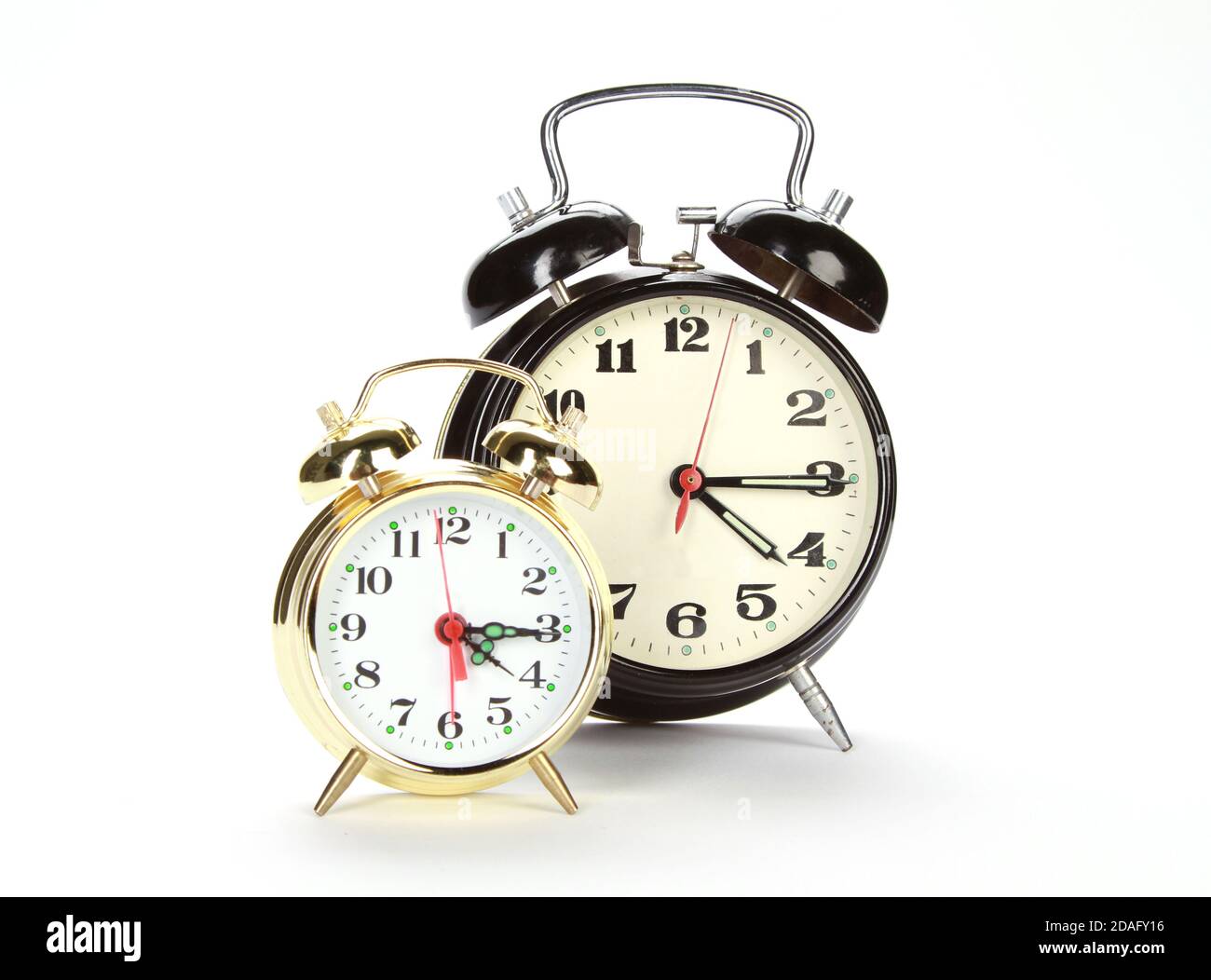 Two different alarm clocks isolated on a white background Stock Photo