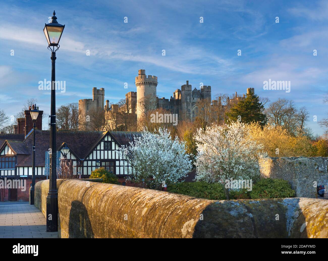 Arundel Castle in Arundel, West Sussex, England a restored medieval castle with fresh spring colour in late afternoon sunset sunlight UK Stock Photo