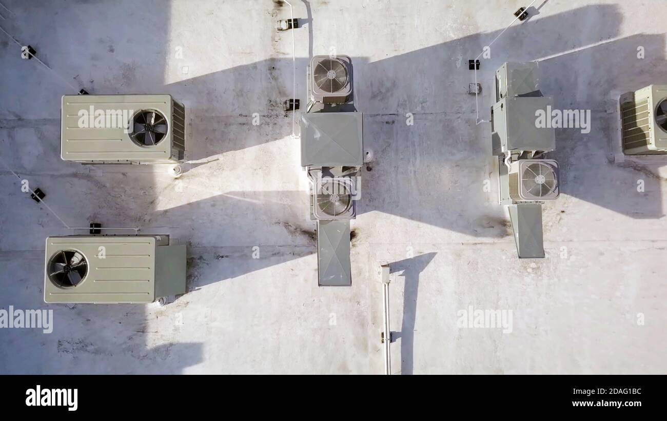 Air conditioning units on top of building in aerial top view. Stock Photo