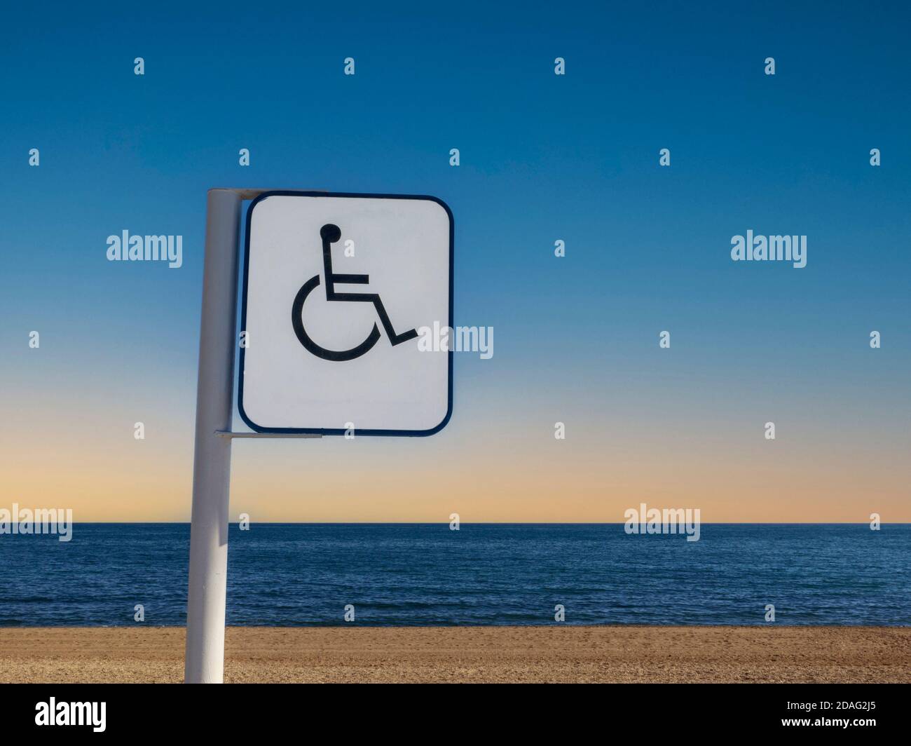 Disabled concept symbol badge plaque internationally recognised sign for vacation access & disabled facilities to beach & sea  Costa Del Sol Spain EU Stock Photo