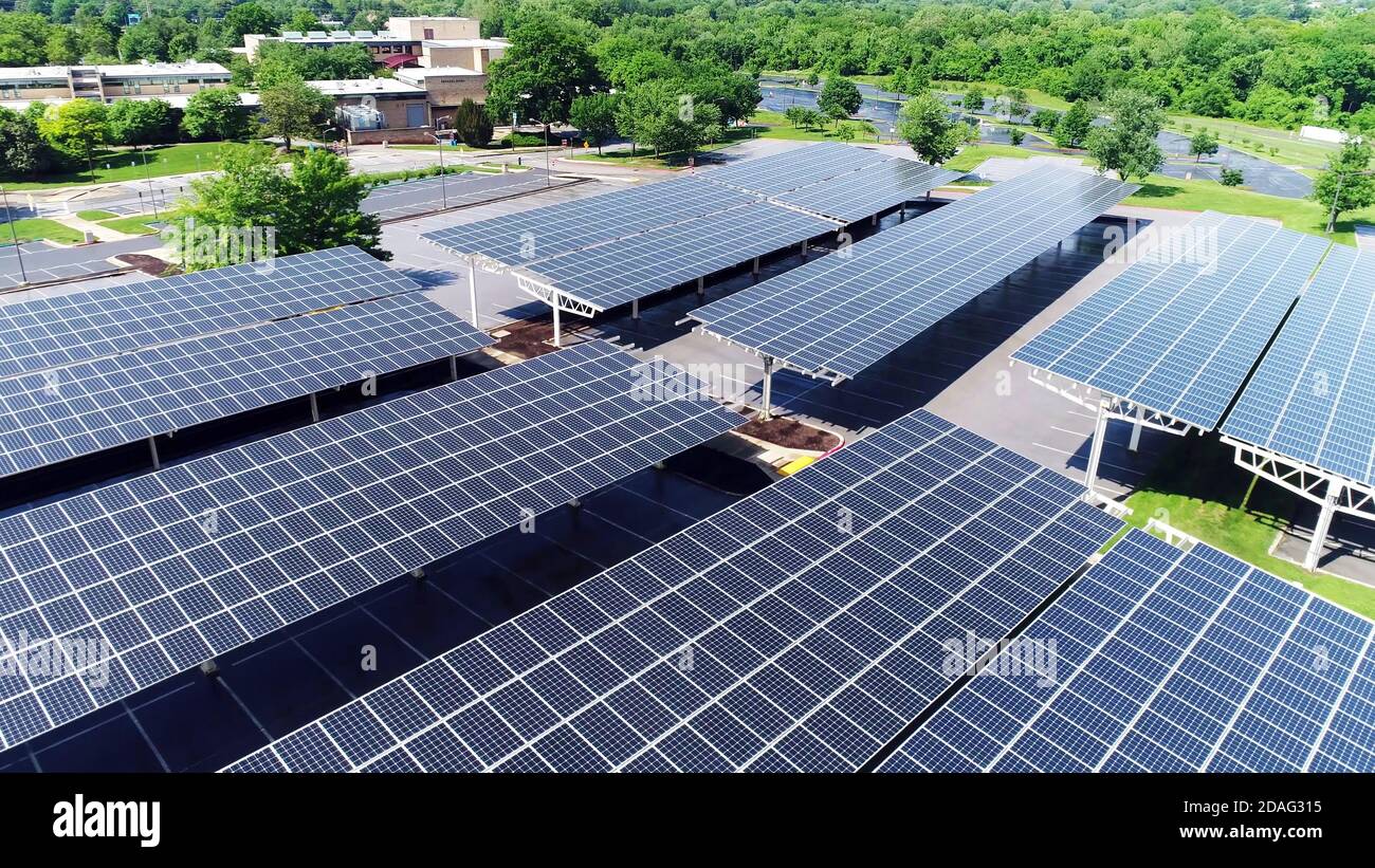 solar energy power in car station, Aerial drone view of solar panel covered parking roof Stock Photo