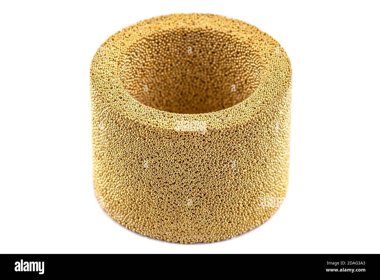 Macro shots of an air silencer element caked with brass balls, isolated
