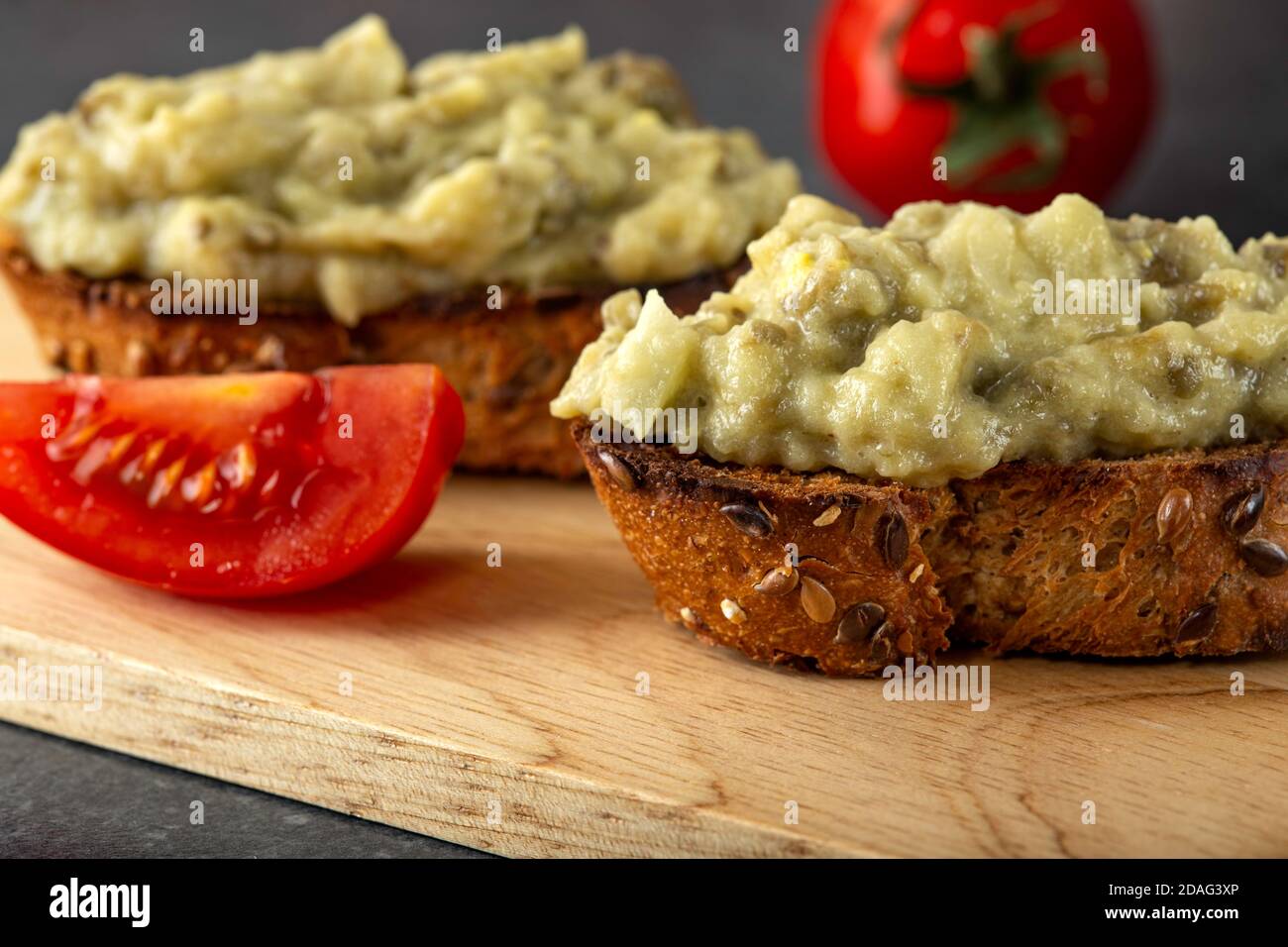 Eggplant salad with onion and mayonnaise on toast Stock Photo