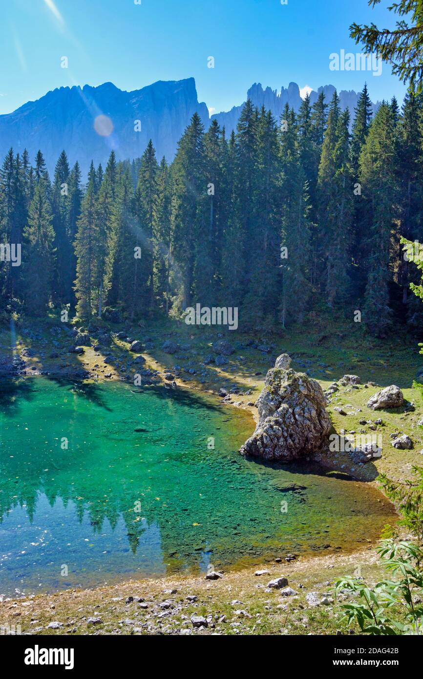 Emerald grre water on Lago di Carezza Stock Photo
