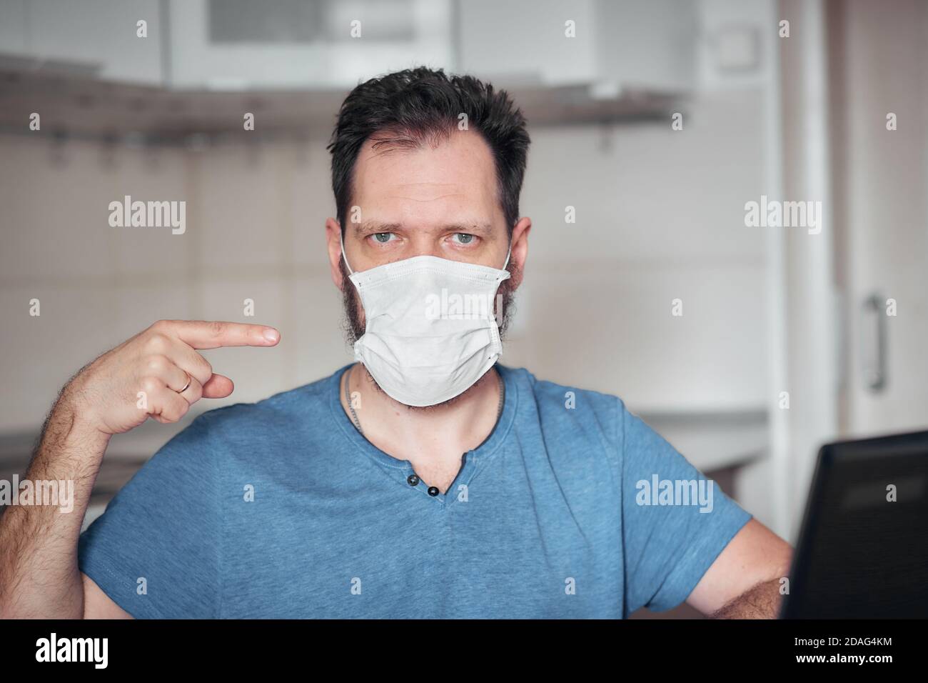 portrait of a man in a medical mask, personal protective equipment ...
