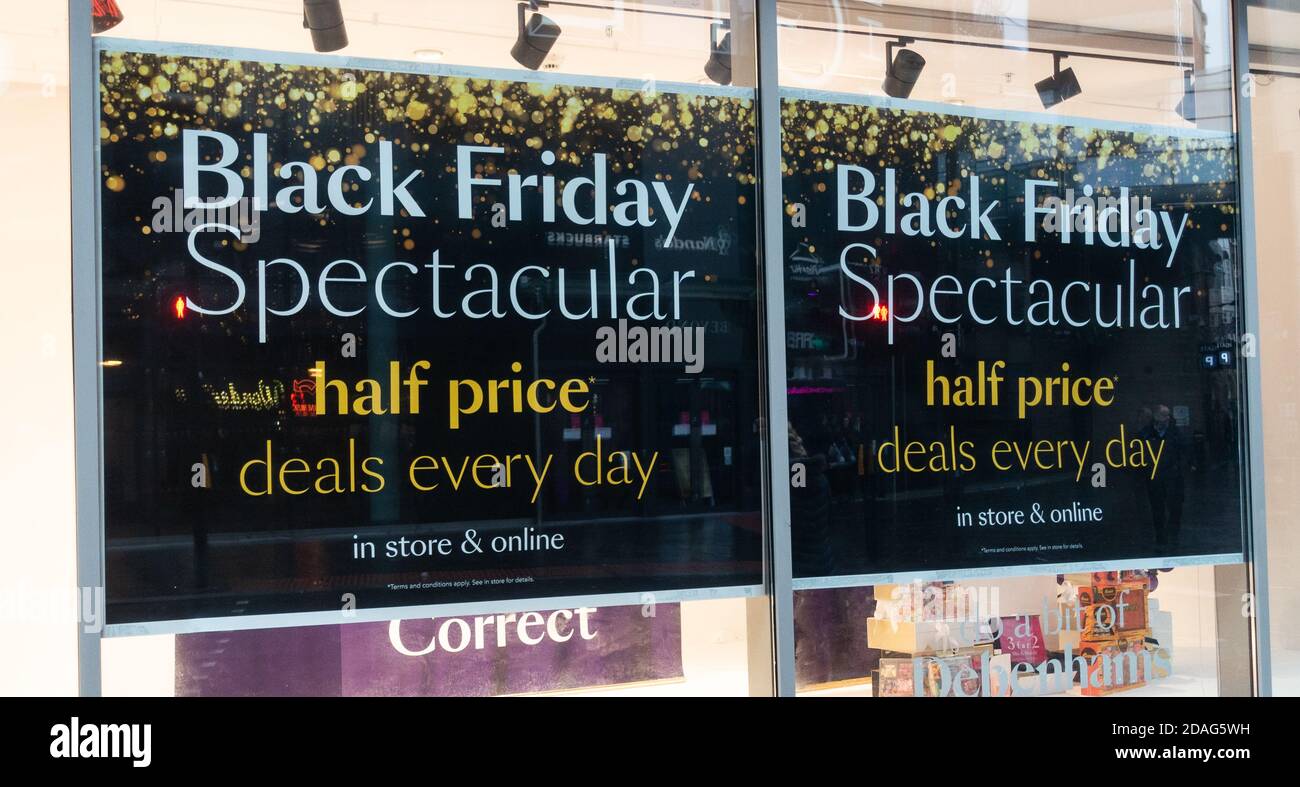 Black Friday half price poster in store window. UK Stock Photo