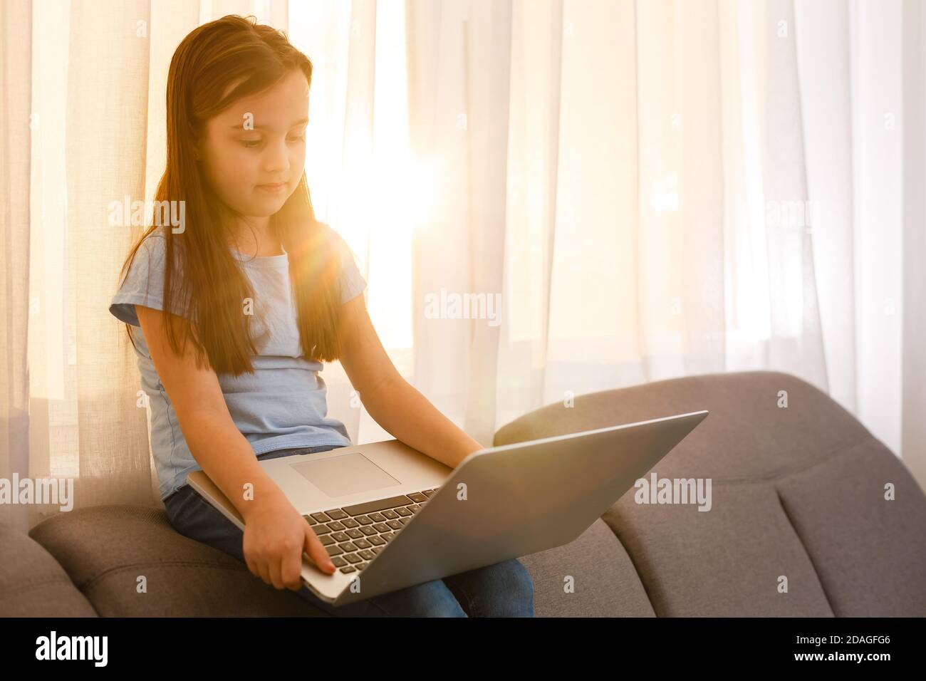 little girl studying with computer Stock Photo - Alamy